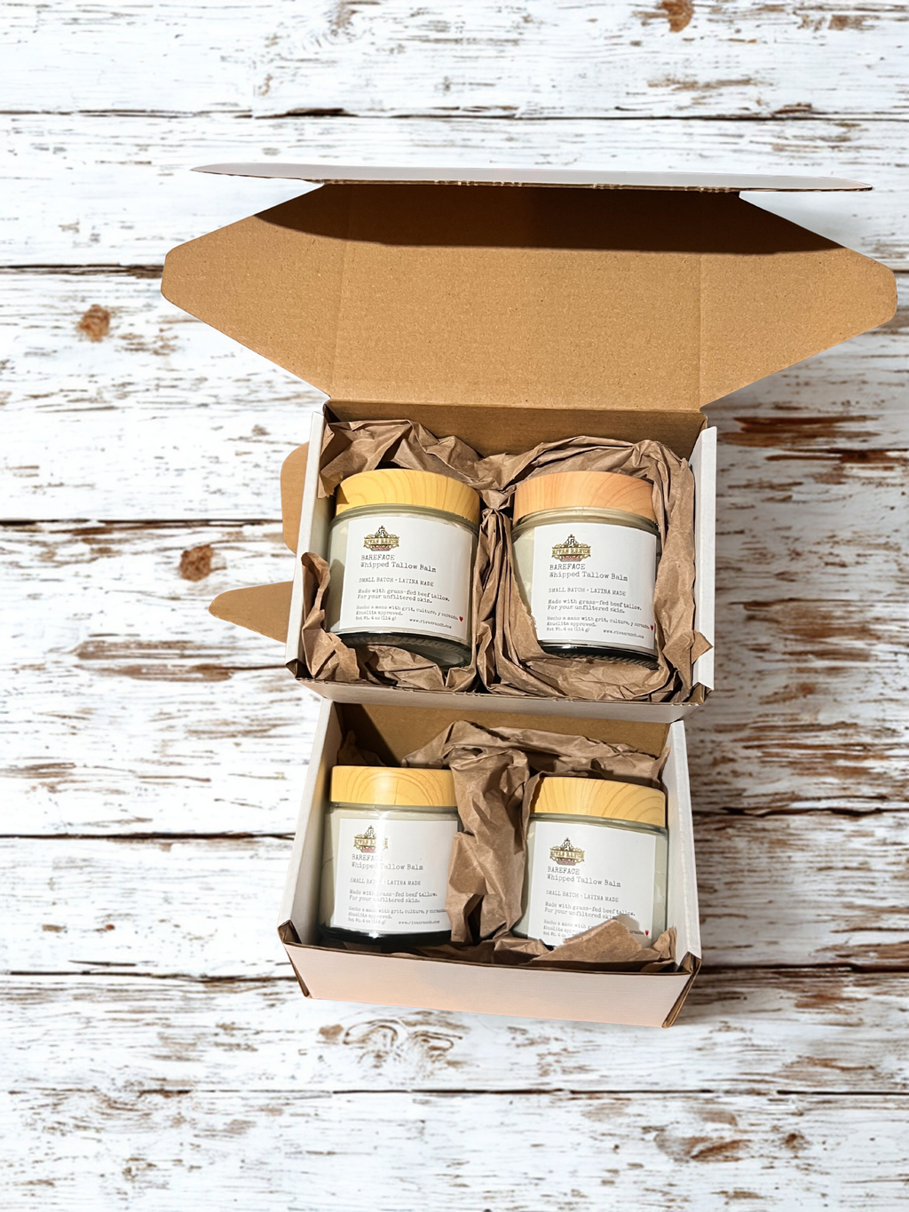 four jars in a gift box of Bareface Facial Tallow Balm with jojoba and calendula for face care